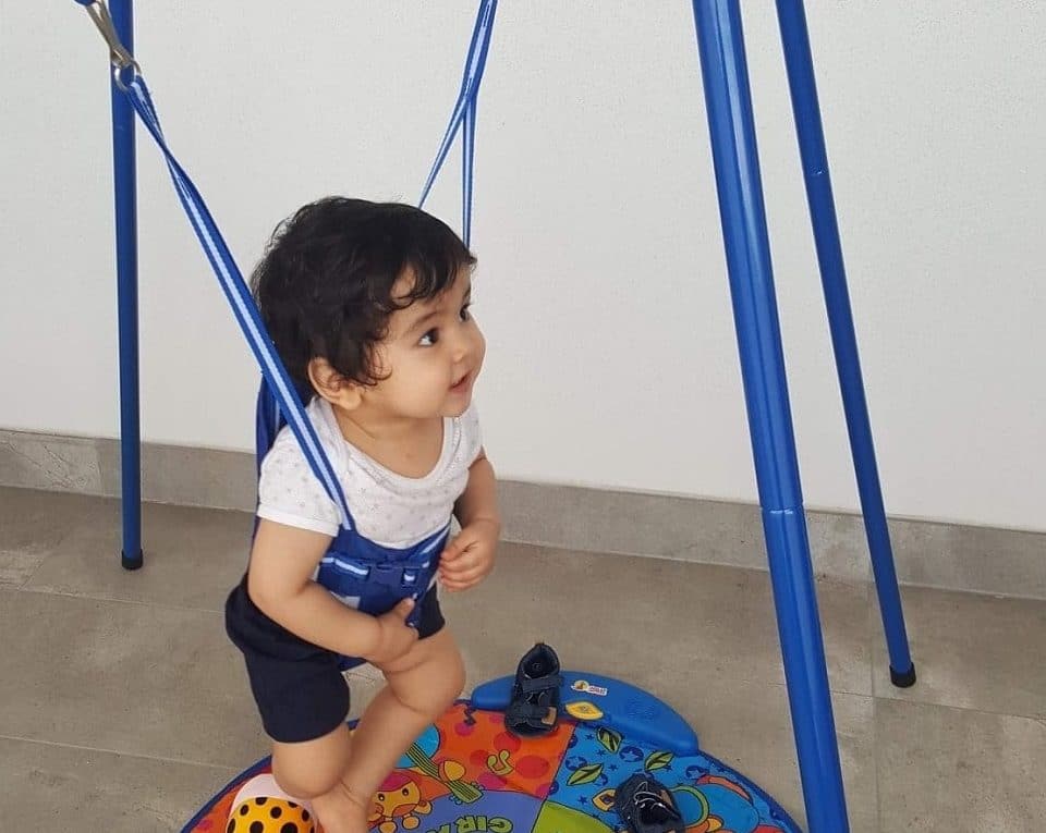 toddler having fun in baby jumper